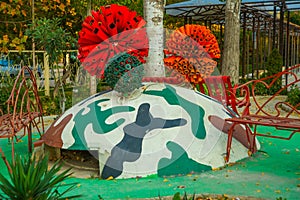VLORA-VLORE, ALBANIA: Colorful bunkers have become the decoration of the yard.