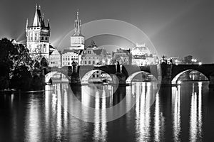 Vltava River and Charles Bridge with Old Town Bridge Tower by night, Prague, Czechia. UNESCO World Heritage Site