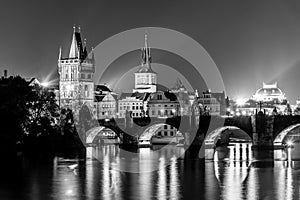 Vltava River and Charles Bridge with Old Town Bridge Tower by night, Prague, Czechia. UNESCO World Heritage Site