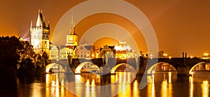 Vltava River and Charles Bridge with Old Town Bridge Tower by night, Prague, Czechia. UNESCO World Heritage Site