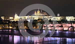 Vltava river, Charles Bridge (Stone Bridge, Prague Bridge) and St. Vitus Cathedral at night. Prague