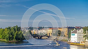 Vltava river timelapse in district Strelecky ostrov with the bridge of the Legions, Prague, Czech Republic photo