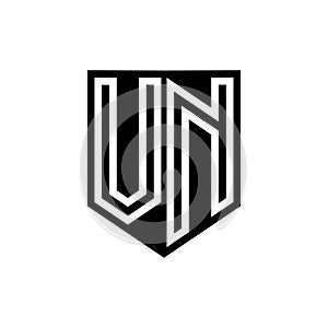 VN Logo monogram shield geometric white line inside black shield color design photo