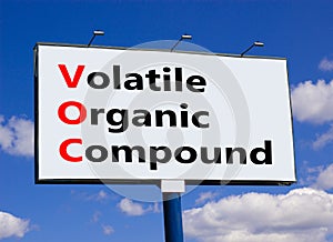 VOC volatile organic compound symbol. Concept words VOC volatile organic compound on beautiful big billboard. Beautiful blue sky photo