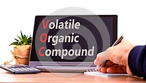 VOC volatile organic compound symbol. Concept words VOC volatile organic compound on beautiful black tablet. Beautiful white