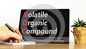 VOC volatile organic compound symbol. Concept words VOC volatile organic compound on beautiful black tablet. Beautiful white