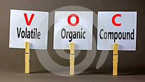 VOC volatile organic compound symbol. Concept words VOC volatile organic compound on beautiful white paper. Beautiful grey photo