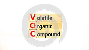 VOC volatile organic compound symbol. Concept words VOC volatile organic compound on beautiful wooden blocks. Beautiful white photo