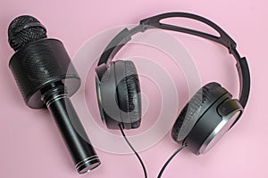 Vocal Bluetooth microphone and headphones on pink background