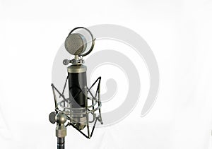 Vocal condenser microphone with wind screen on white background