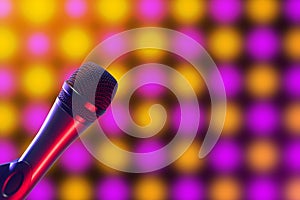 Vocal microphone on pink, purple and yellow disco background lighting
