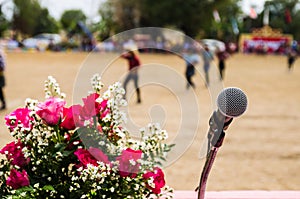 Vocal microphone in sharp focus against blurred audience