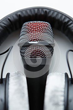Vocal microphone and studio headphones in close up. Record voice with professional mic