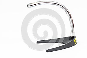 Vocal Microphone on the table stand isolated above white background