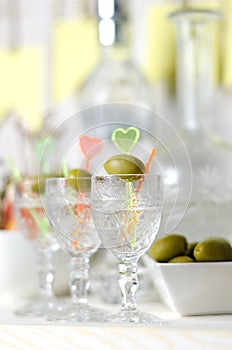 Vodka in the glass with olive. Drink bar, party