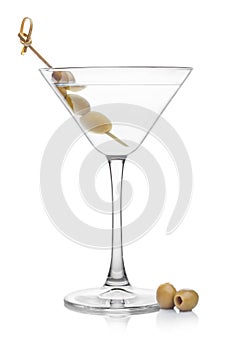 Vodka martini gin cocktail in classic glass with olives on bamboo stickwith fresh green olives on white background with reflection