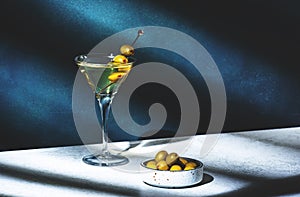 Vodka martini with olives, alcoholic cocktail drink with vodka and vermout, dark green background, bright hard light and shadow