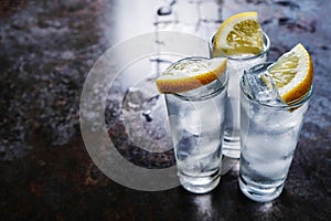 Vodka in shot glasses on stone table