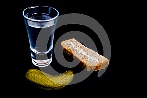 Vodka shot with snacks