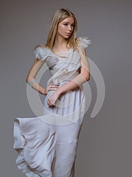 Vogue style portrait. Elegant woman wearing fashion dress in studio. Beautiful girl wear fashion clothes casual dress