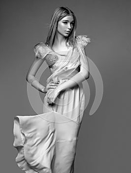 Vogue style portrait. Elegant woman wearing fashion dress in studio. Beautiful girl wear fashion clothes casual dress