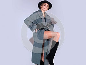 Vogue style portrait. Fashion photo of a beautiful young woman in a pretty dress over studio background. Fashion model