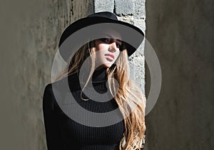 Vogue woman in fashion hat. Fashion outdoor photo of gorgeous sensual woman in elegant dress clothes. Beauty and fashion