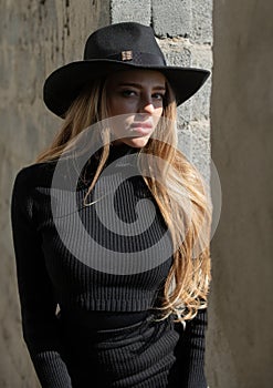 Vogue woman in fashion hat. Fashionable young model in style dress. Fashion woman in summer.