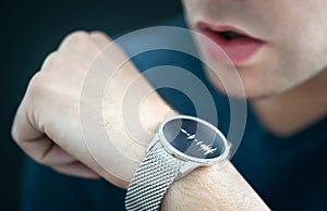 Voice recording or speech recognition technology in smart watch. Man talking to smartwatch mic and recorder.