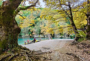 Voidomatis river in aristi village trees rafting boats in autumn season