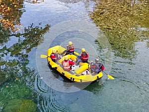 Voidomatis river in aristi village trees rafting boats in autumn season