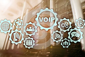 VoIP Voice over IP on the screen with a blur background of the server room. The concept of Voice over Internet Protocol.