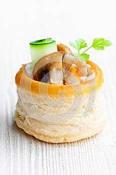 Vol-au-vents puff pastry cases filled with mushrooms and chicke