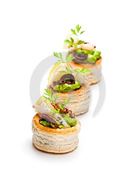 Vol-au-vents puff pastry cases filled with salted squid and oct