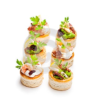 Vol-au-vents puff pastry cases filled with salted squid and oct