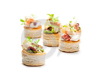 Vol-au-vents puff pastry cases filled with salted squid and oct