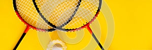 Volant and racket, badminton on yellow background. Concept excitement, resistance, competition. Pop Art Banner photo