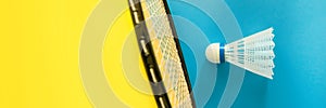 Volant and racket for playing badminton on yellow background. The concept of summer entertainment. Minimalism Pop Art