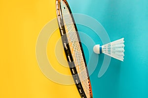 Volant and racket for playing badminton on yellow background. The concept of summer entertainment. Minimalism Pop Art