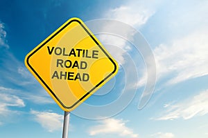 Volatile road ahead road sign with blue sky and cloud background