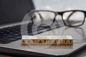 VOLATILITY letter blocks business finance concept on laptop keyboard