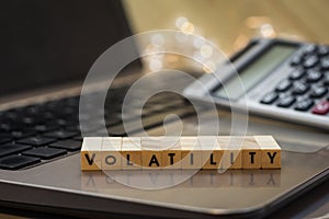 VOLATILITY letter blocks business finance concept on laptop keyboard