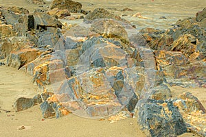 Volcanic basalt rocks formation by the seaside in Tanjung Kempit, Mersing, Johor, Malaysia.