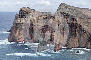 Volcanic cliffs at island northern shore on Atlantic ocean, Ponta do Rosto, Madeira photo
