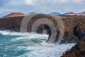 Volcanic coastline near Los Hervideros lava caves in Lanzarote,