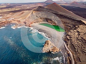 Volcanic crater with a green lake in El Golfo, Lanzarote. Aerial view