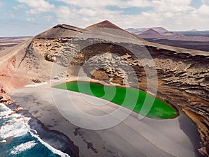 Volcanic crater with a green lake in El Golfo, Lanzarote. Aerial view