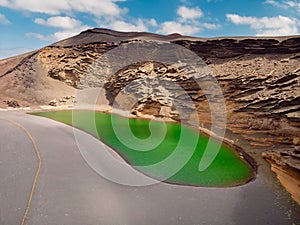 Volcanic crater with a green lake near El Golfo, Lanzarote. Aerial view