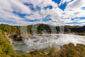 Volcanic crater with steaming lake