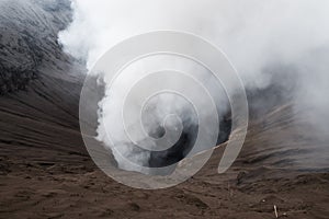 Volcanic eruption, close up on crater with smoke, Mount Bromo, Indonesia